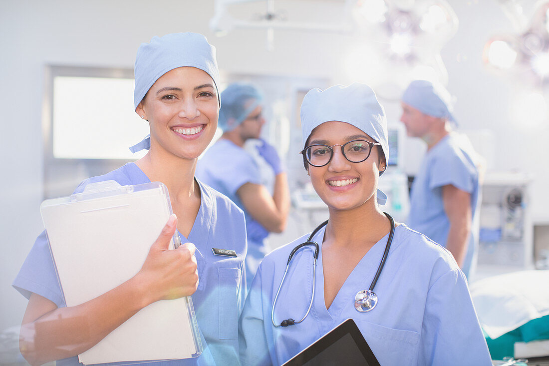 Portrait smiling, confident female surgeons