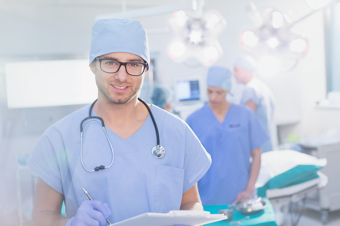 Surgeon in eyeglasses with clipboard