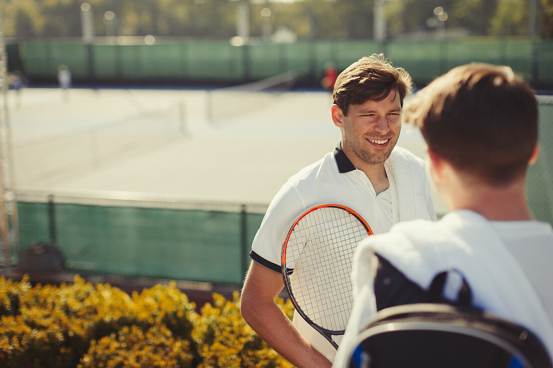 Young tennis players talking