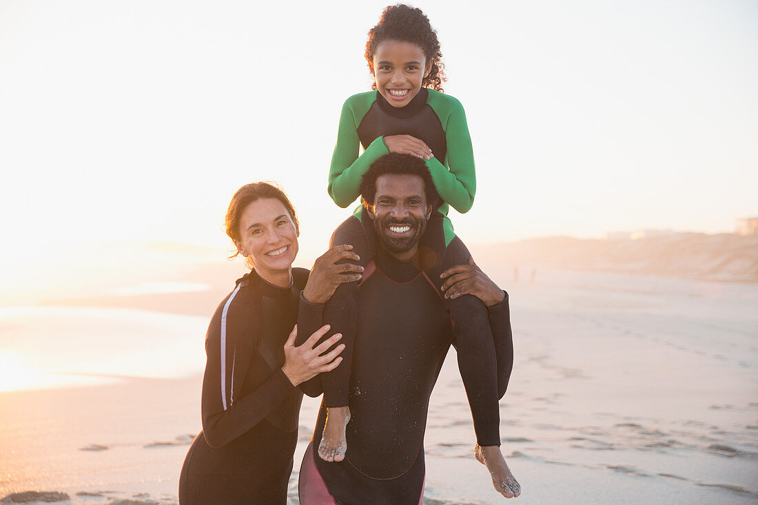 Portrait happy family in wet suits