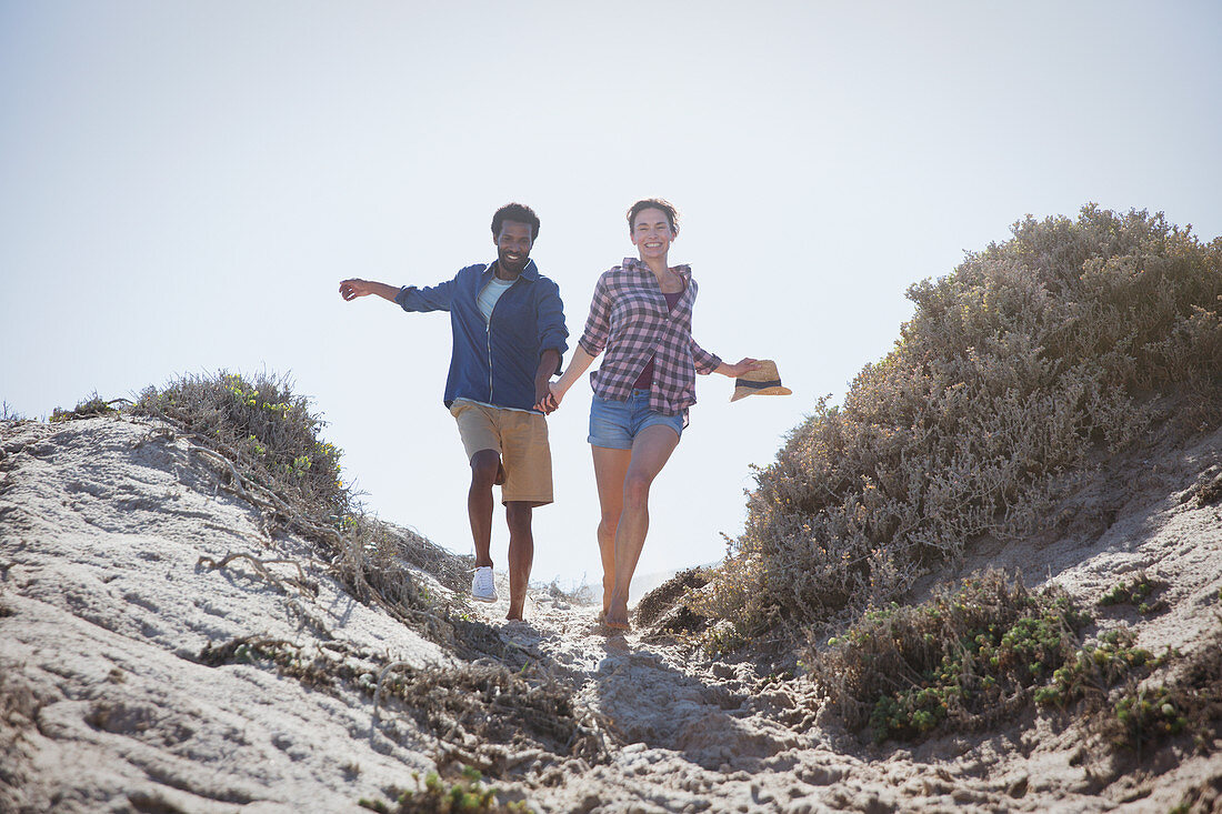 Playful, energetic couple running