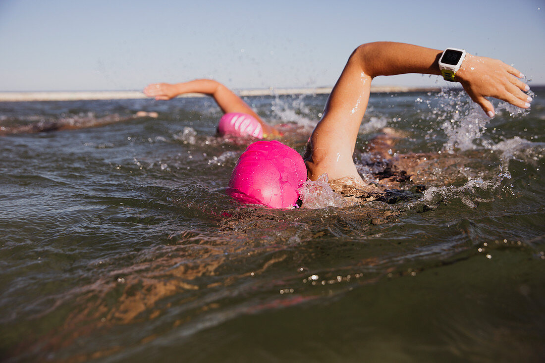 Female swimmer with smart watch swimming