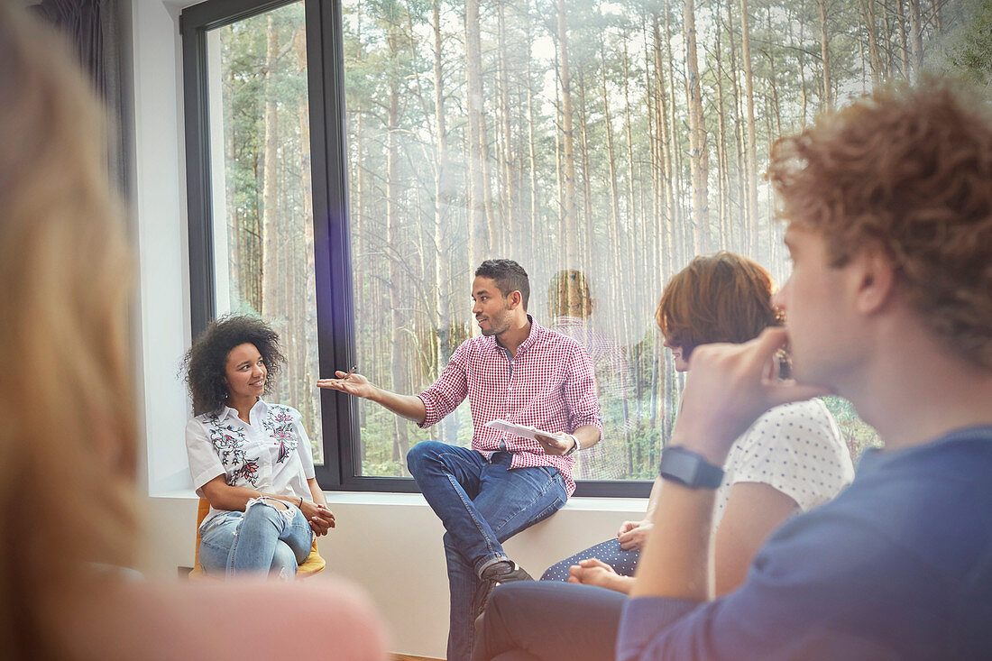 Man talking in group therapy session