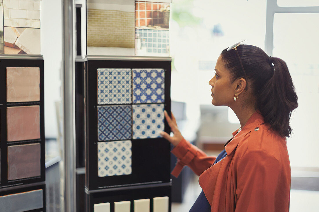Woman browsing tile samples