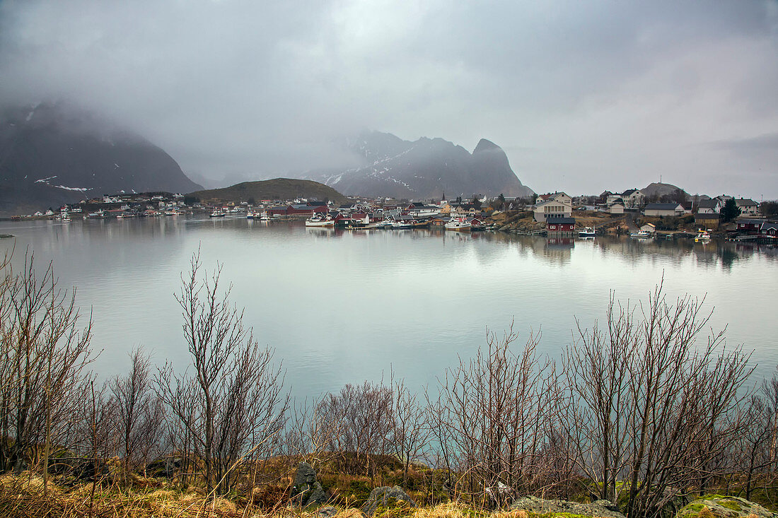 Fishing village along calm lake, Norway