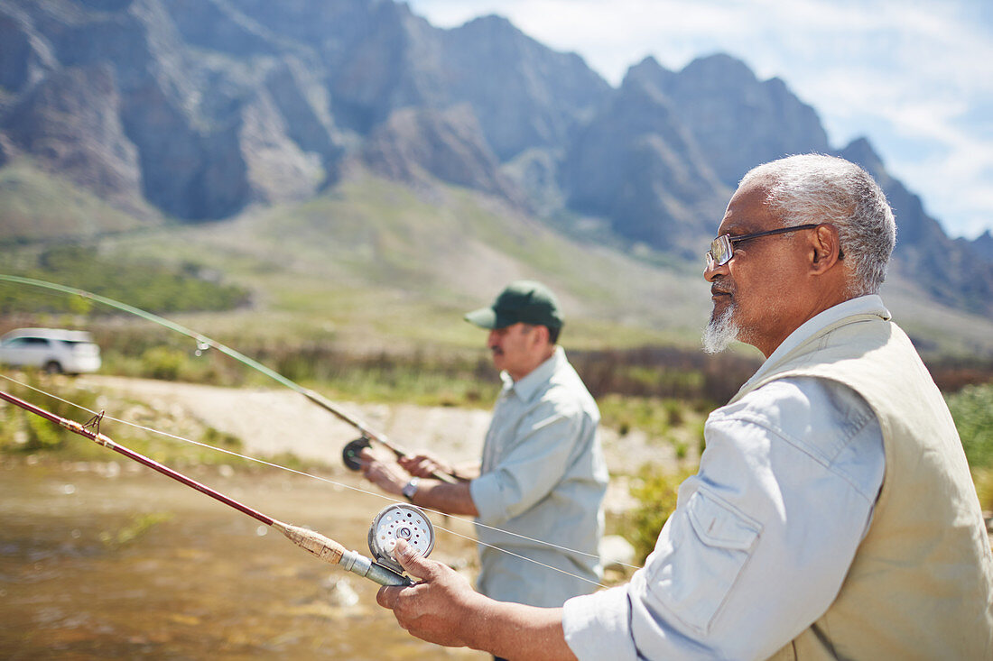 Active senior men friends fishing