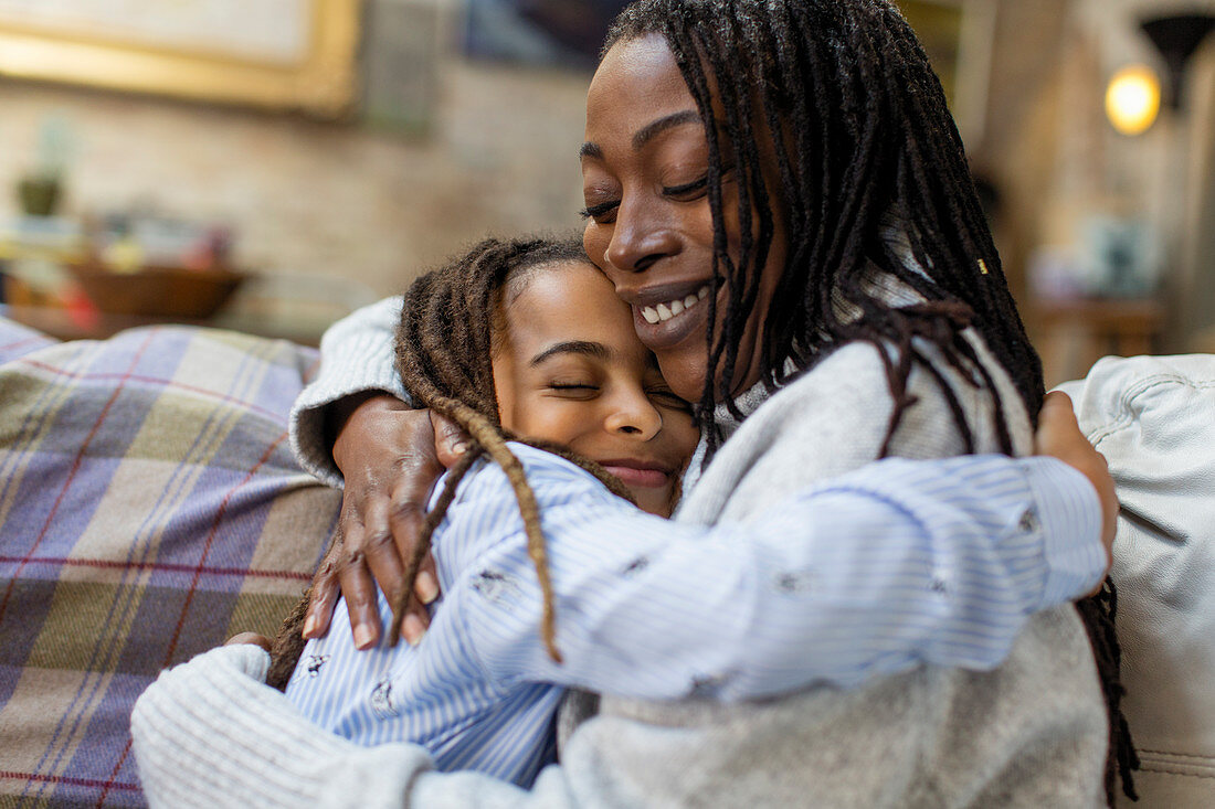 Affectionate mother and daughter hugging