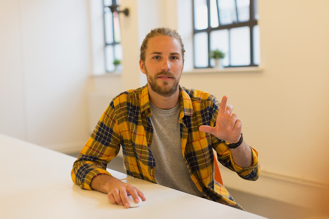 Portrait creative businessman using computer