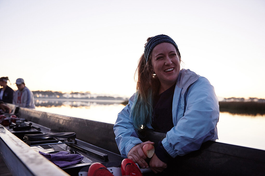 Portrait smiling, confident female rower at scull