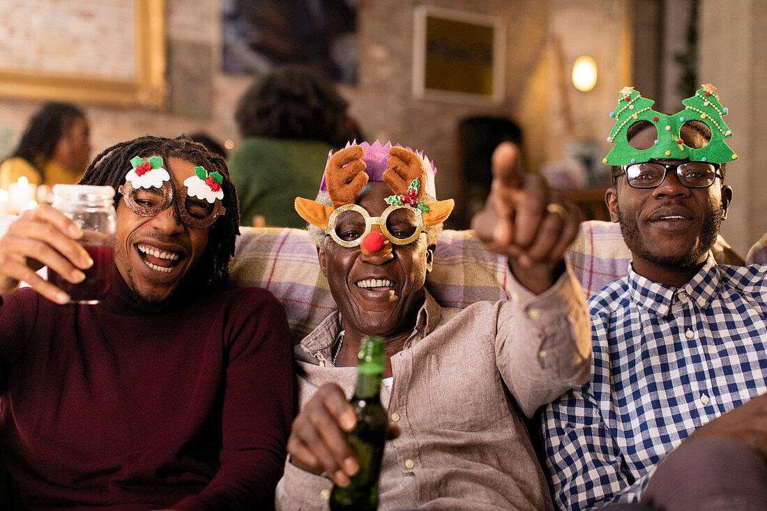 Family wearing Christmas costume goggles