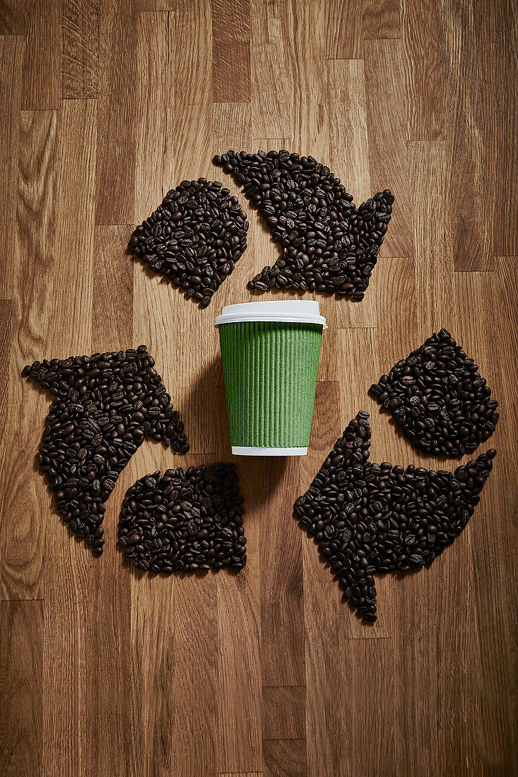 Coffee beans forming recycle symbol