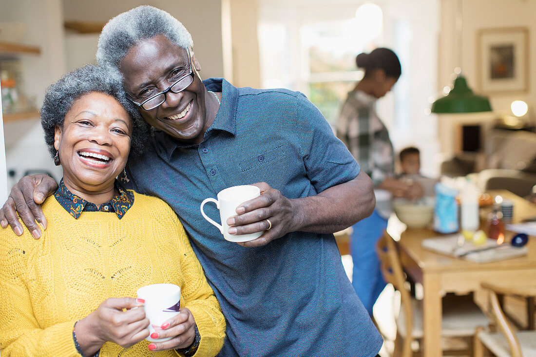 Portrait affectionate senior couple drinking coffee