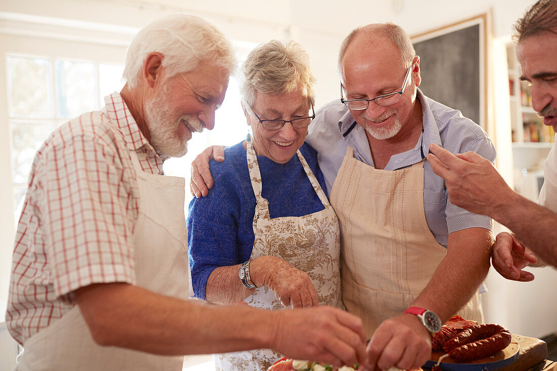 Senior friends enjoying cooking class