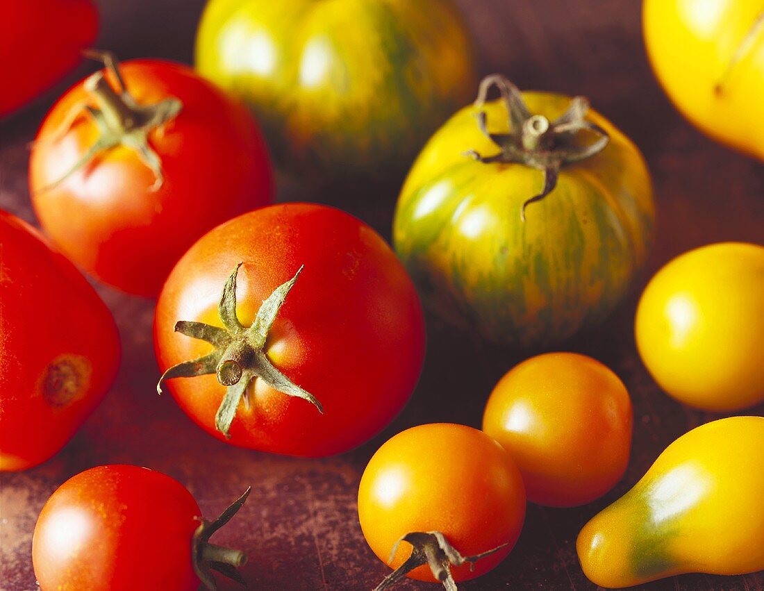 Various types of tomatoes; red, yellow and greenish