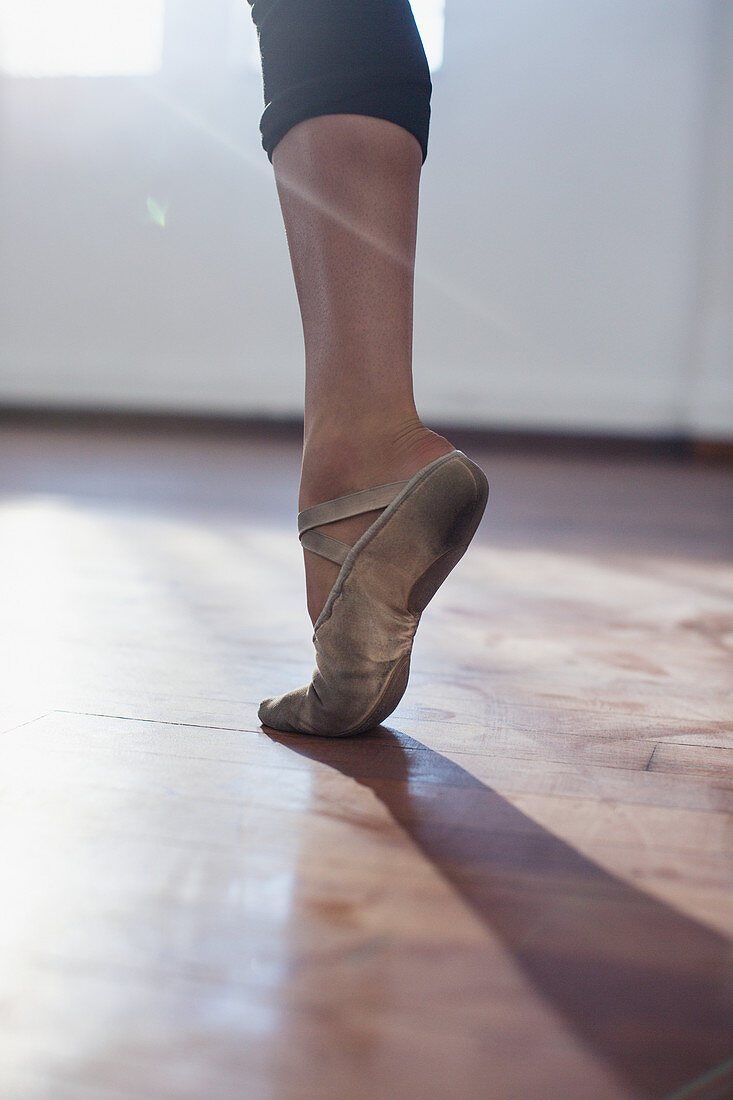 Ballet dancer practicing in ballet shoe