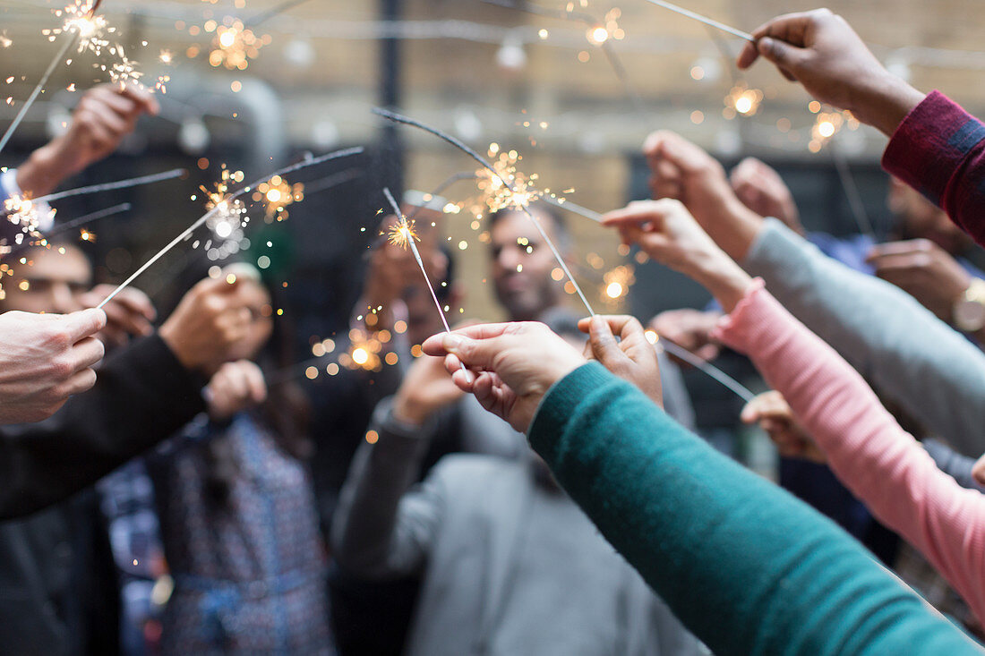 Friends celebrating with sparklers