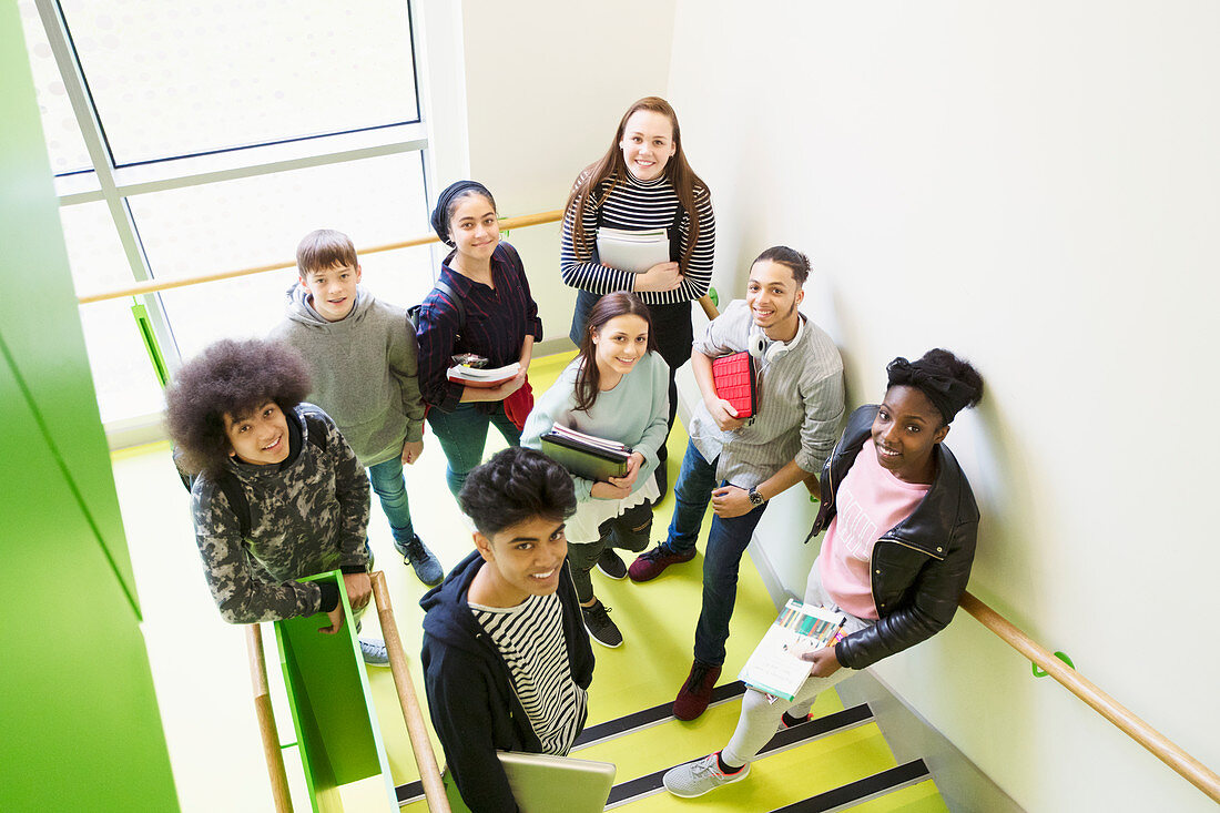 Portrait high school students on stair landing