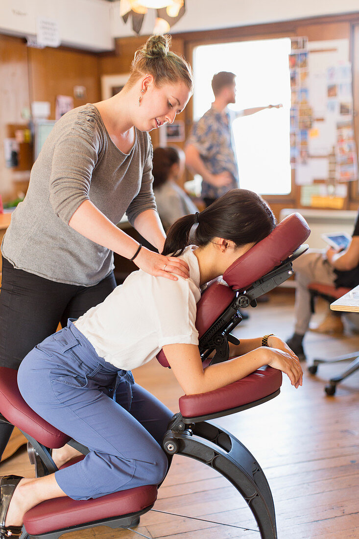 Creative businesswoman receiving massage