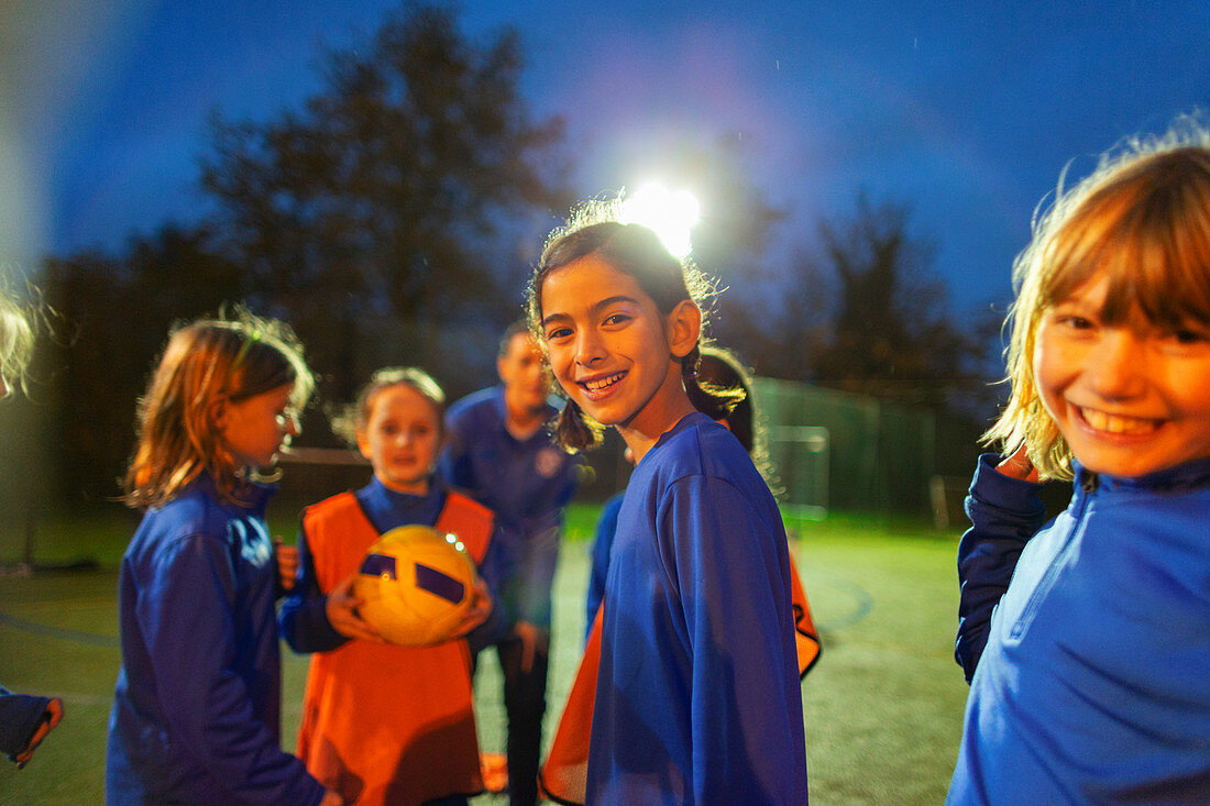 Portrait smiling girls soccer team