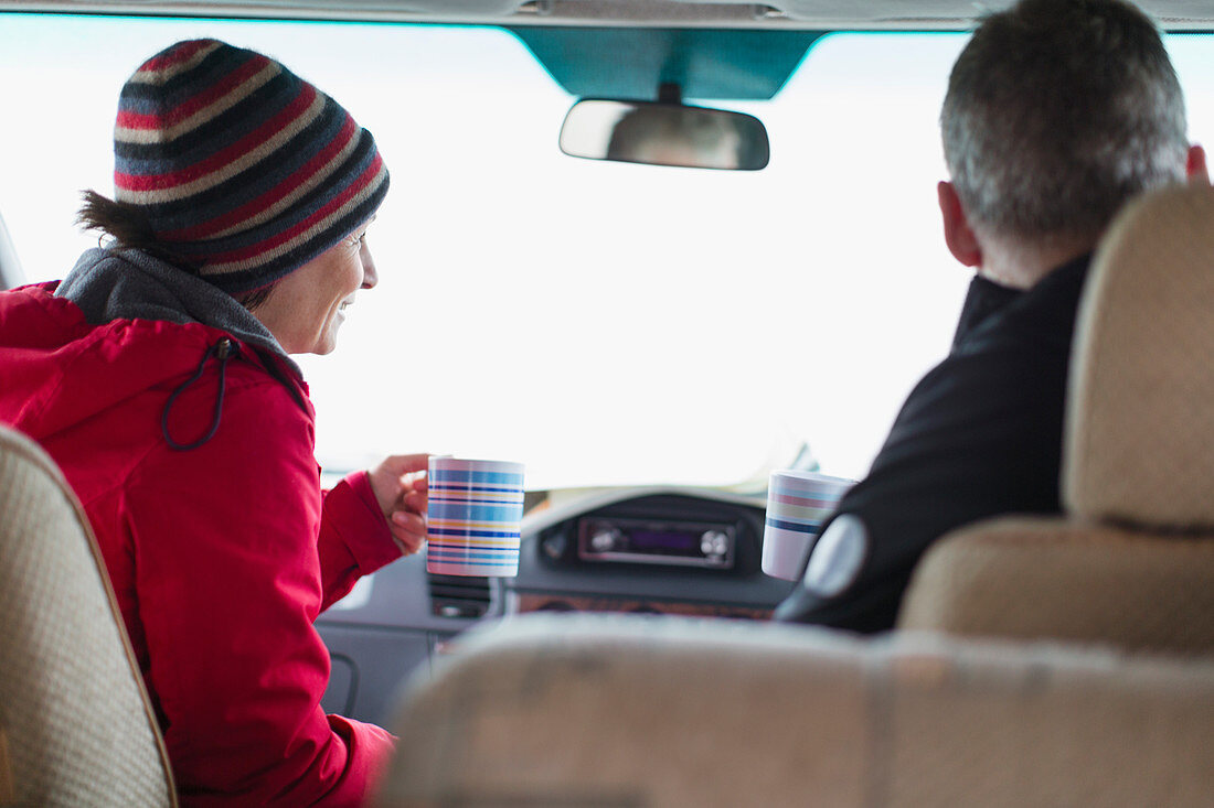 Couple drinking coffee in motor home