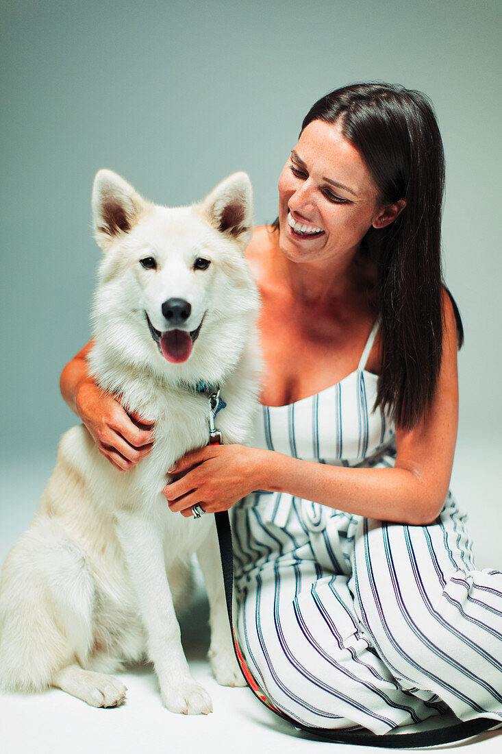 Portrait happy woman with dog