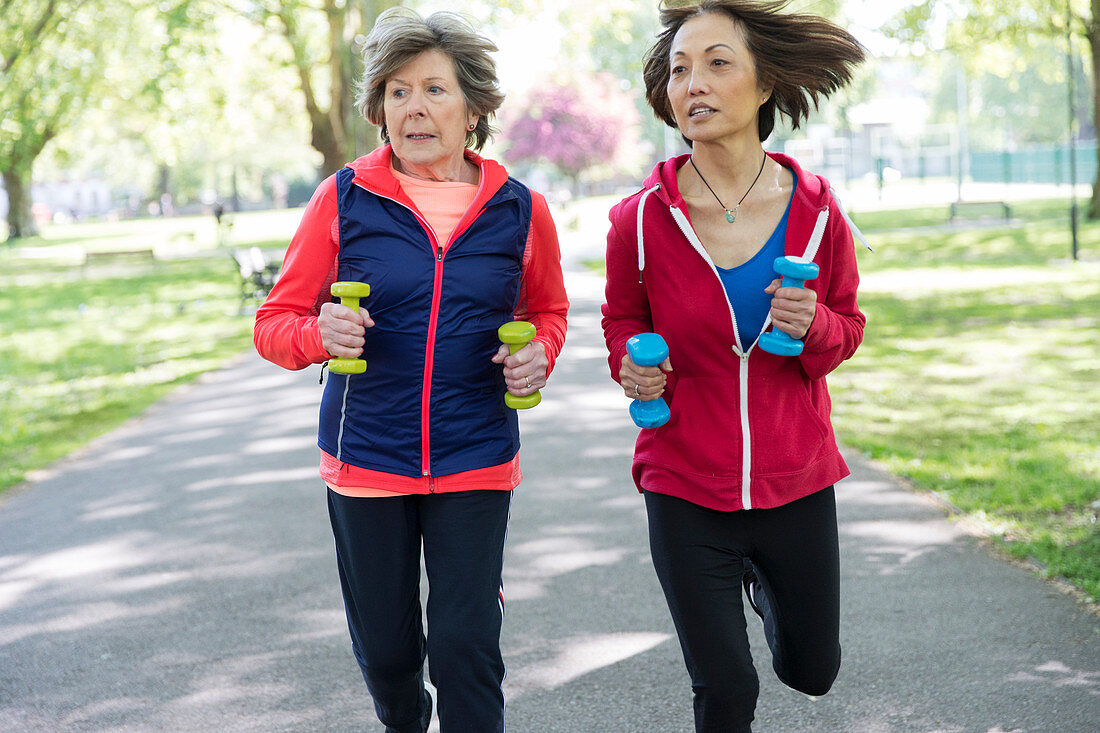 Active senior women friends jogging