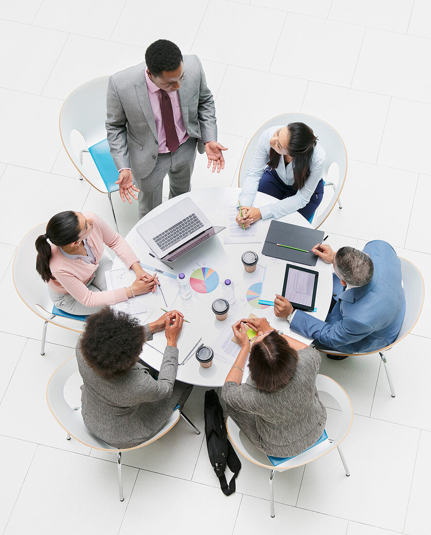 Businessman leading meeting at round table