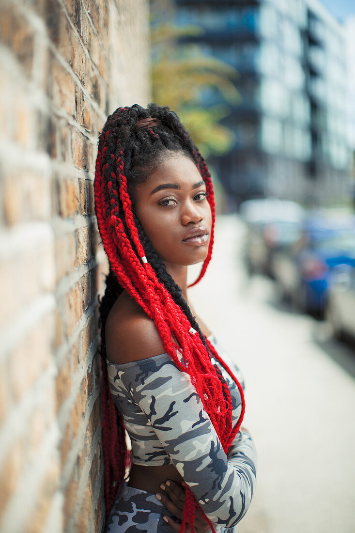 Young woman with long red braids