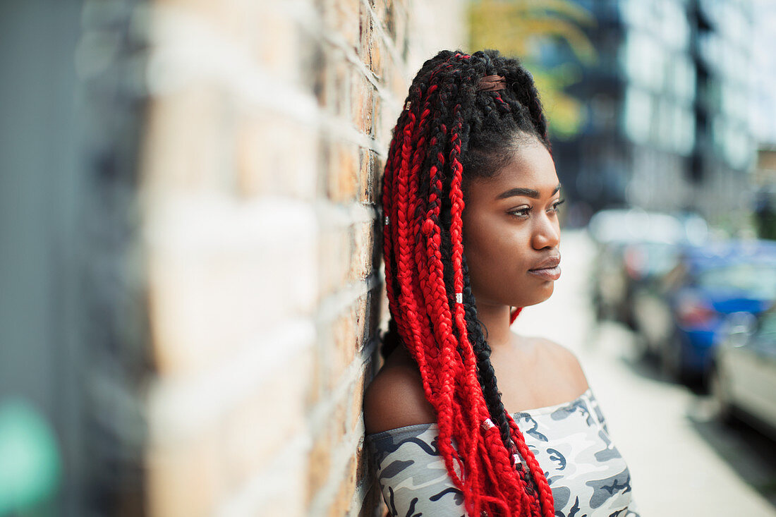 Confident woman with red braids