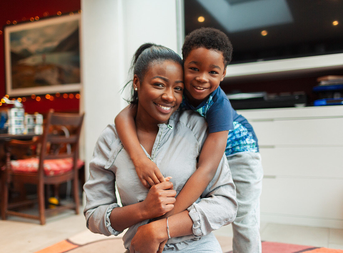 Portrait affectionate mother and son hugging