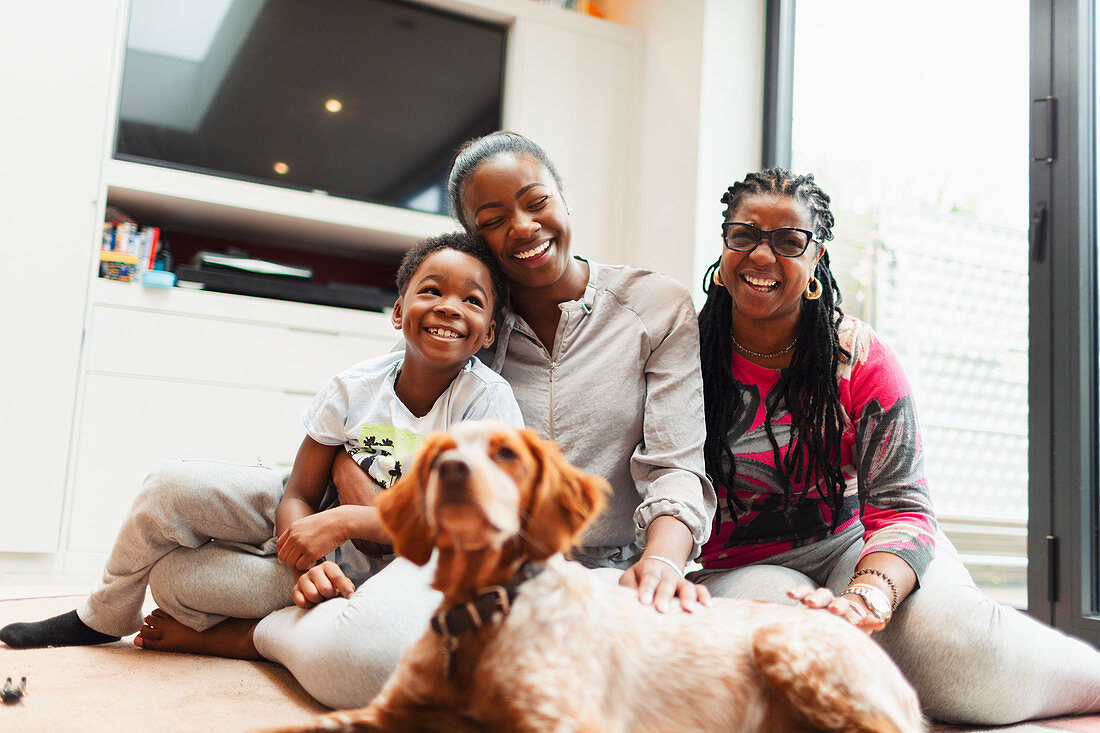 Family with dog on living room floor