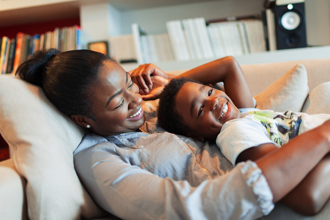 Portrait , affectionate mother and son cuddling