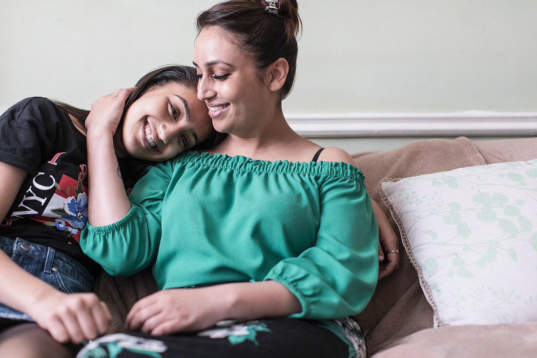 Affectionate mother and daughter hugging