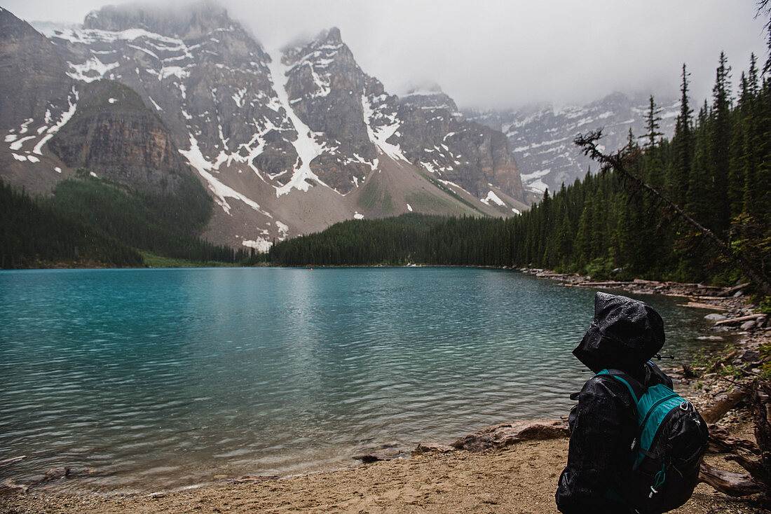 Serene hiker in rain jacket, Canada