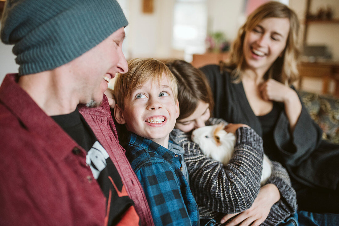 Happy family with guinea pig
