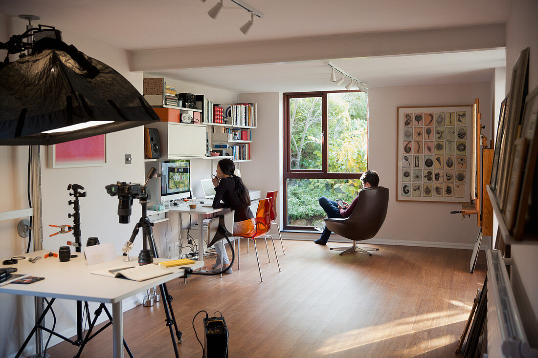 Couple working and reading in home office