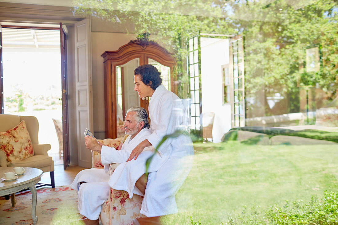 Mature couple in bathrobes relaxing