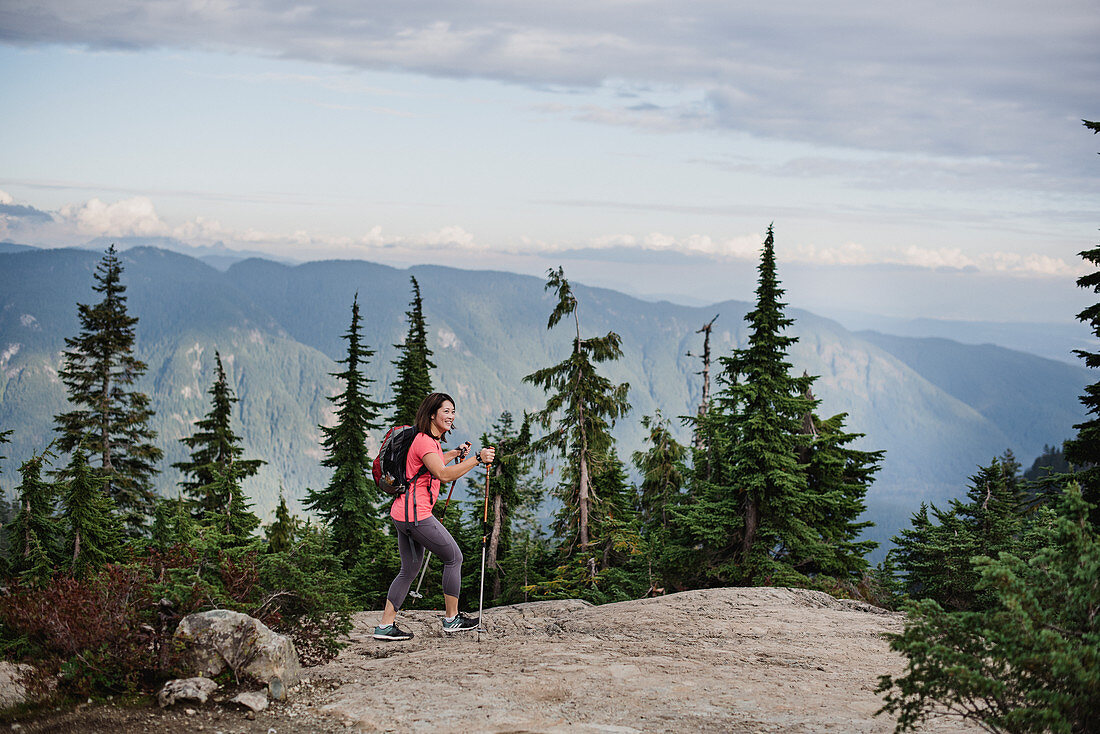 Woman hiking on mountaintop, Canada