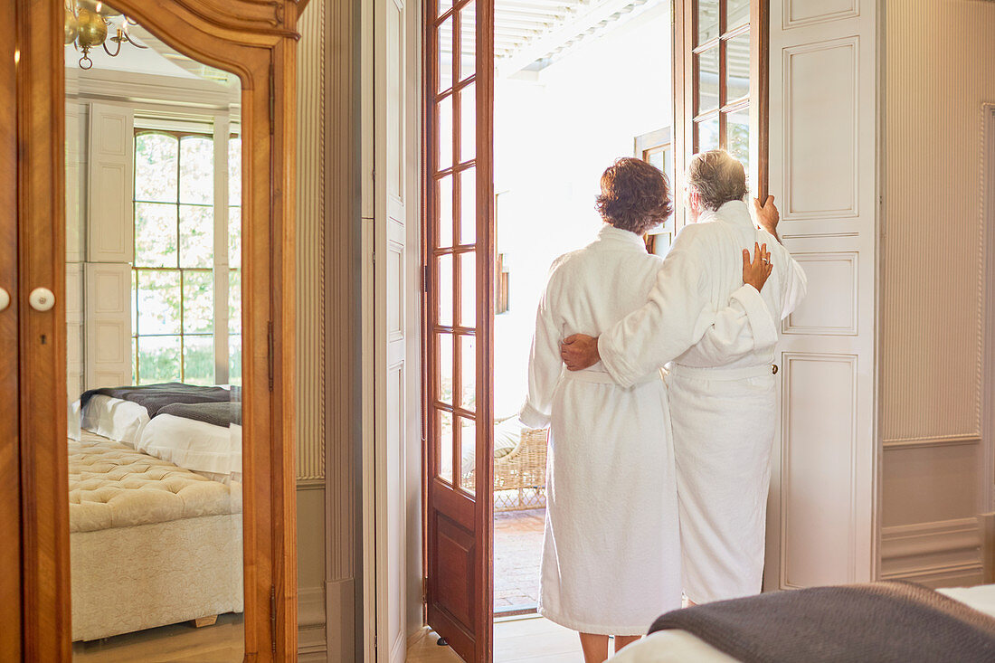 Mature couple in spa bathrobes