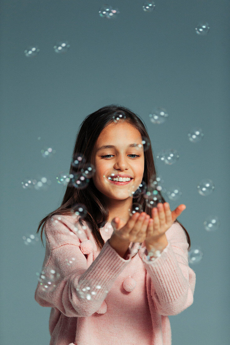 Playful girl with bubbles