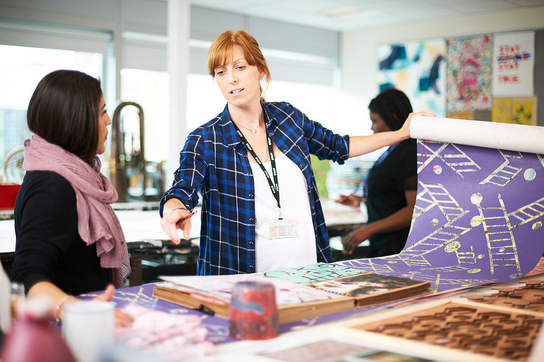 Women screen printing in art studio