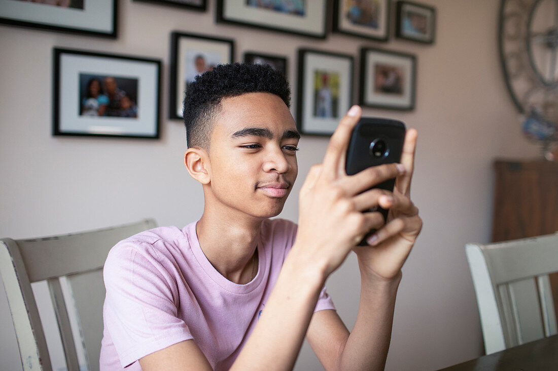 Teenage boy using smart phone