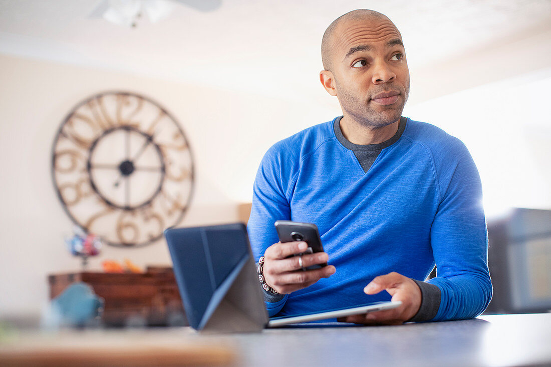 Man using digital tablet and smart phone