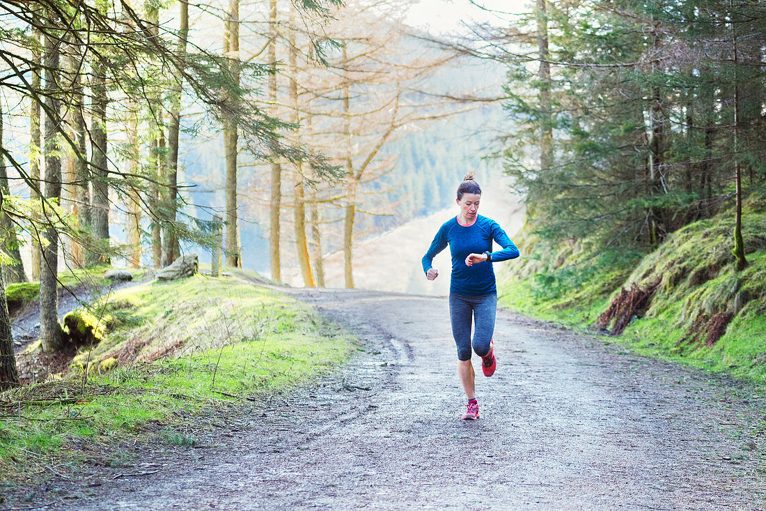 Woman jogging in woods
