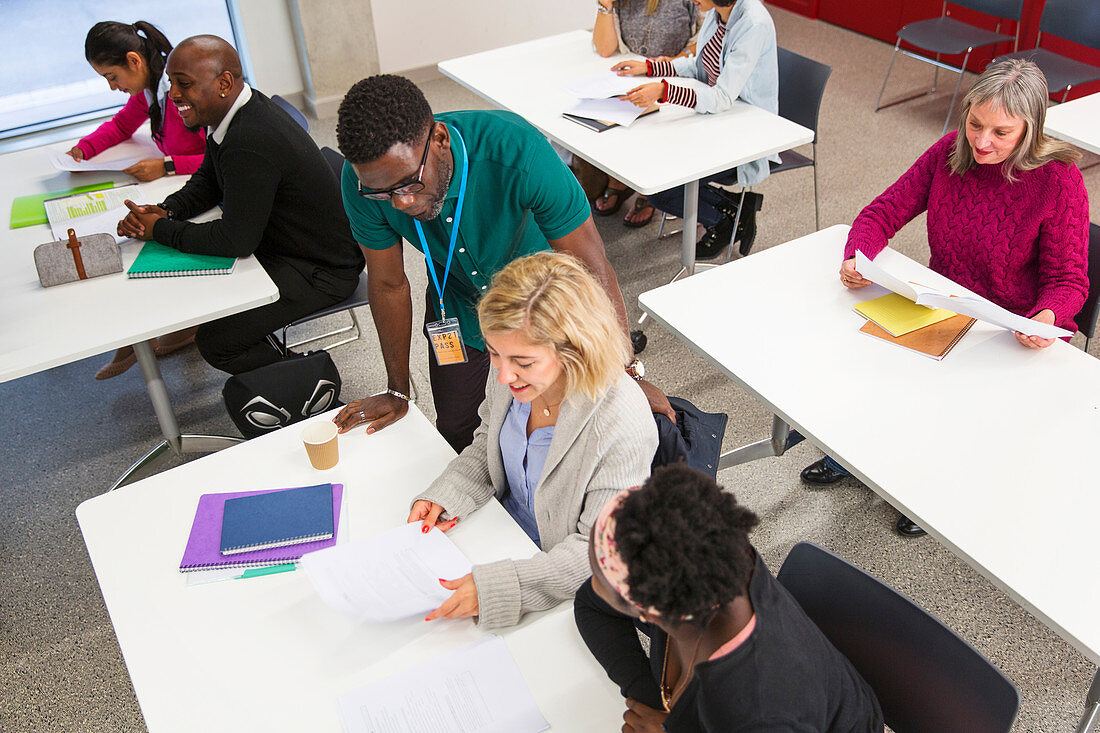 Community college teacher and students in classroom