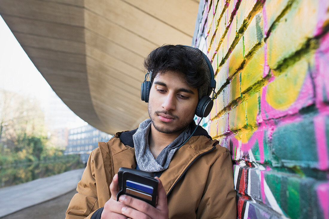 Young man with headphones listening to music