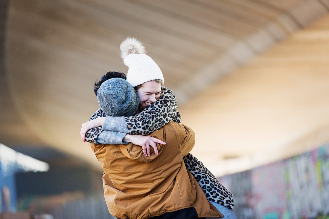 Happy young couple hugging