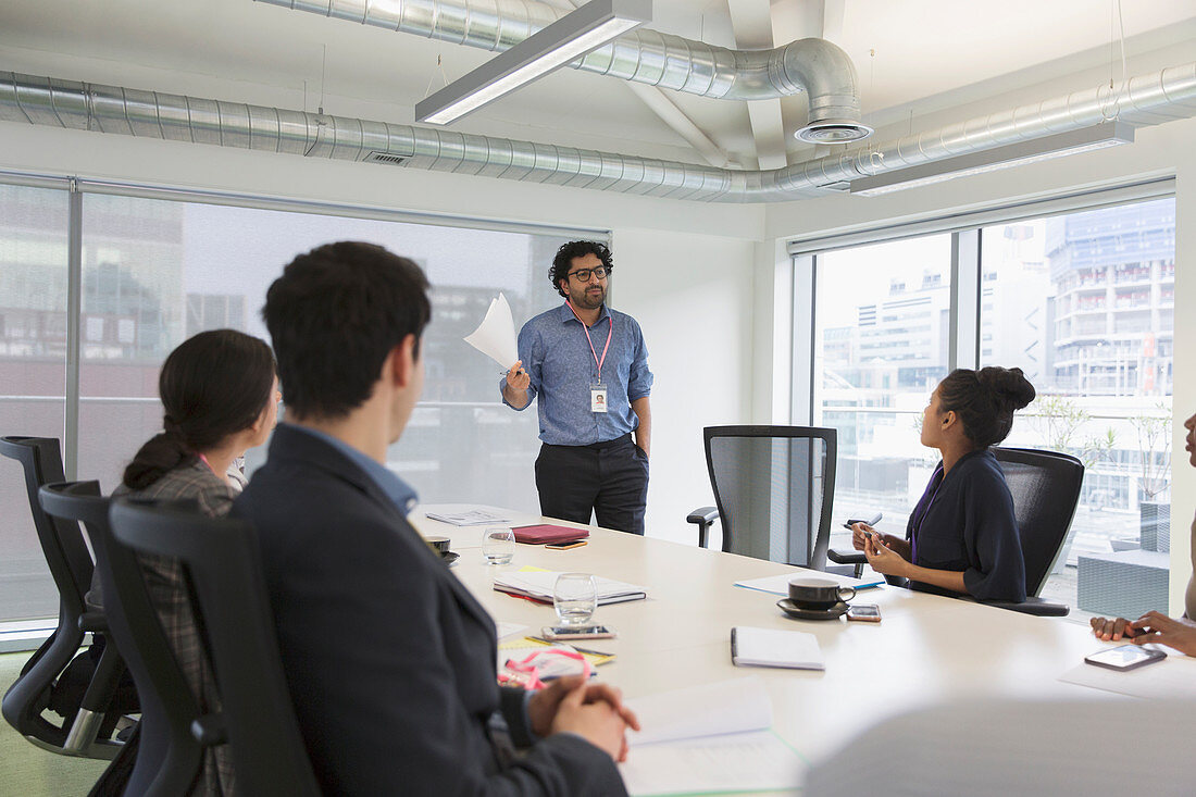 Businessman leading conference room meeting