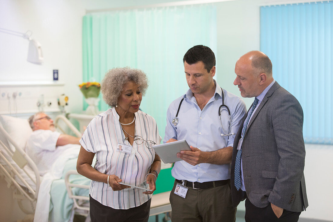 Doctors with tablets making rounds