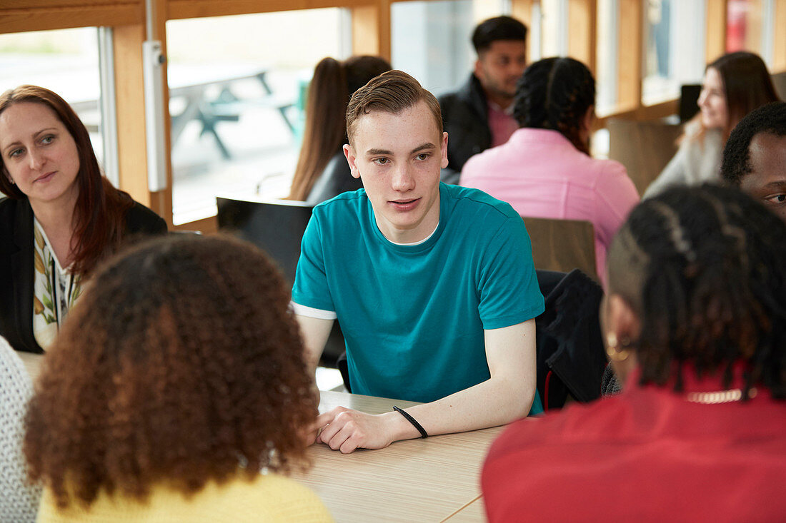 College students talking in classroom